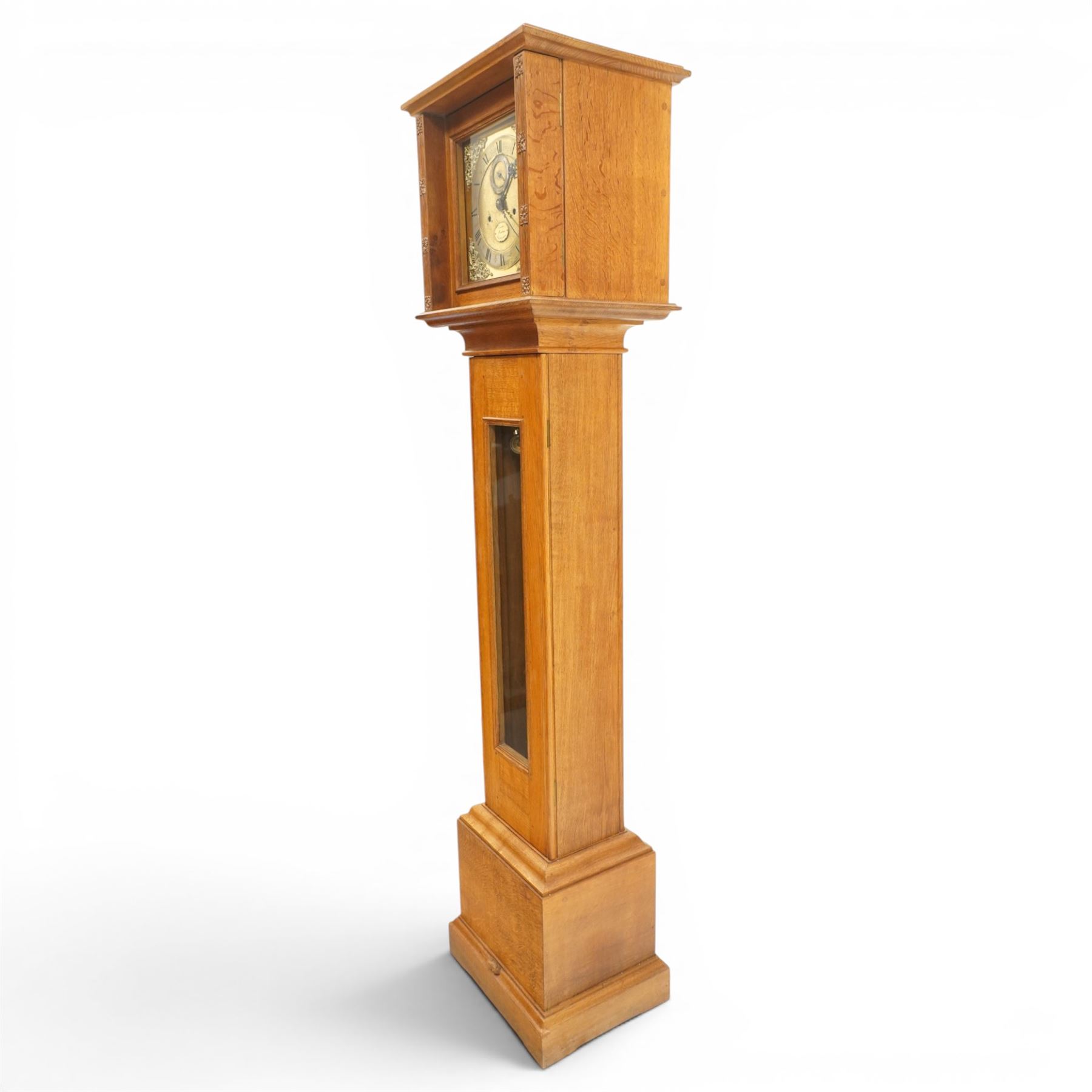 Mouseman - mid-20th century oak longcase clock, with a high quality weight driven movement and dial by Sinclair and Harding & Co of Cheltenham, the rectangular hood carved with foliate ornament, over a glazed and oak trunk on stepped base, with carved mouse signature, by the workshop of Robert Thompson of Kilburn Provenance: purchased directly from the Kilburn workshop in the 1940s/1950s