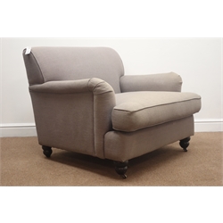  Large armchair upholstered in grey fabric, turned feet on castors, W95cm  