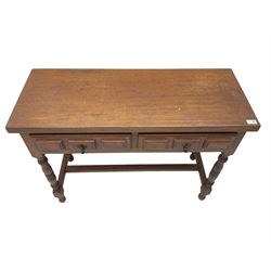 Spanish oak side table, fitted with two drawers with moulded facias, raised on turned supports united by stretcher