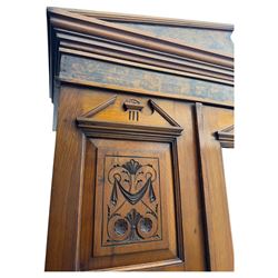 Victorian walnut bedroom suite - wardrobe, dressing chest and bedside cupboard, comprising a full-length wardrobe with broken pediment and central mirrored door, large lower drawer, a matching dressing table with bevelled swing mirror over two trinket drawers and two short drawers over two long drawers, and a single-door bedside cupboard, all with moulded edges, decorative panel work and shaped aprons