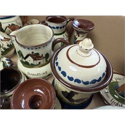Collection of Torquay and similar Motto ware, including jugs, candlesticks, twin handled mug etc 