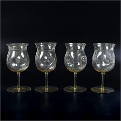 Four Arts and Crafts drinking glasses of dimple form, probably James Powell, Whitefriars, together with a dimple decanter, glasses H12cm