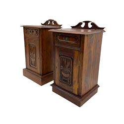 Pair Victorian style hardwood bedside cabinets, fitted with single drawer and cupboard, the doors carved with floral urns, on plinth bases