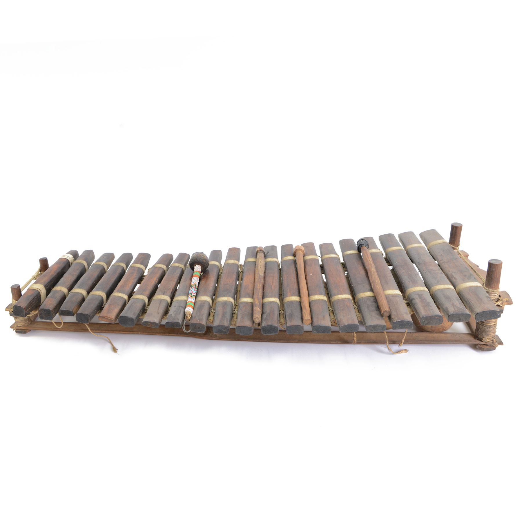 West African gourd-resonated balafon, with twenty hardwood tone bars and four beaters, L112cm