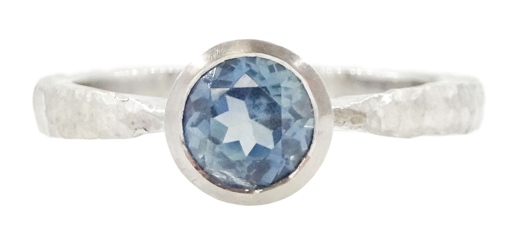 Platinum sapphire ring, single bezel set sapphire of approx 1.00 carat, to a planished shank, London 2019