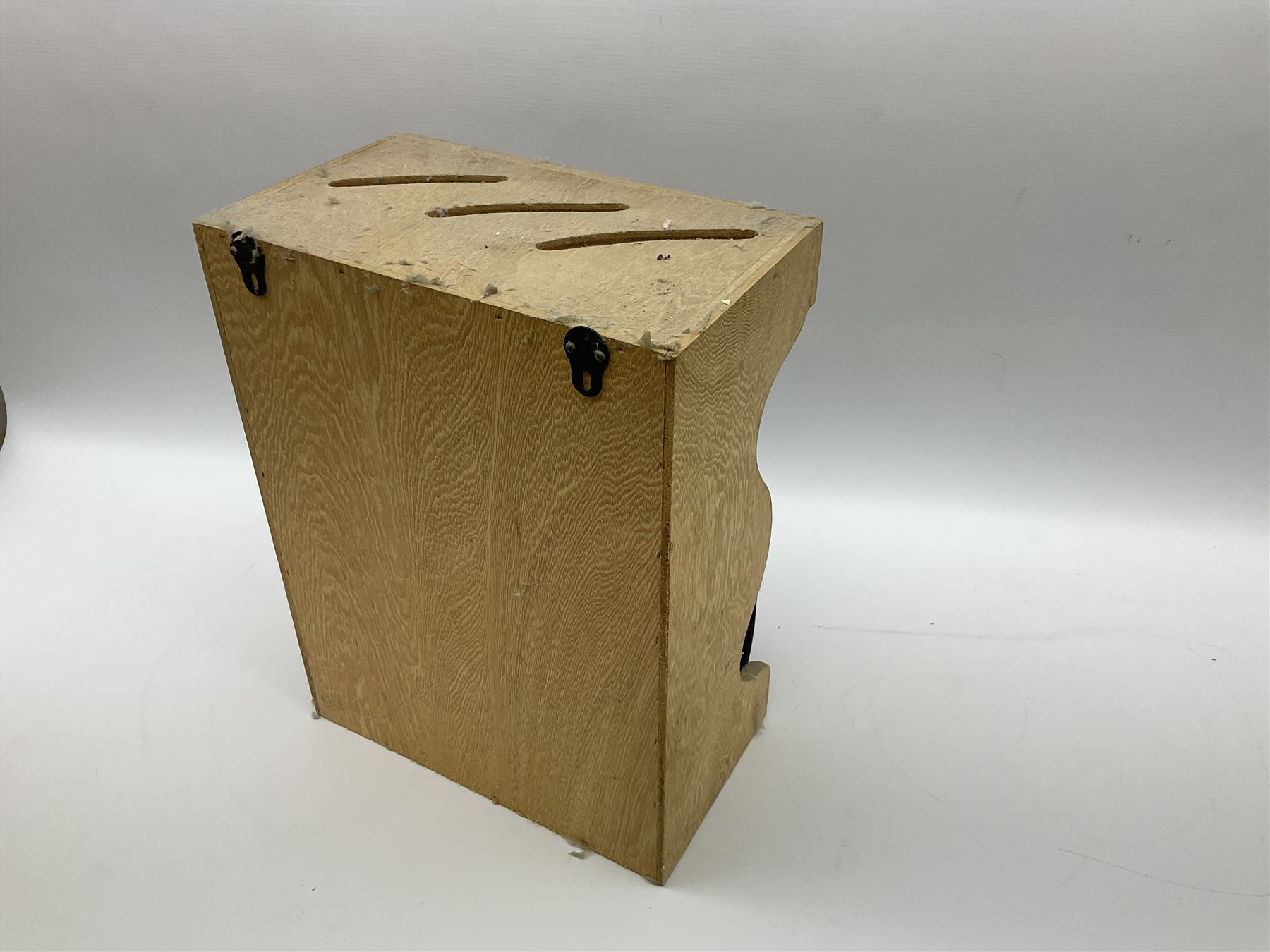 Le Creuset 'Volcanic Orange' cast iron and enamel milk pan with wood handle together with a three piece red cast iron Cousances saucepan set of graduating form, with lids housed in original wooden hanging stand and further Cousances lidded casserole dish and pan