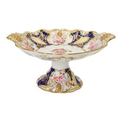 Collection of 19th century porcelain dessert wares, comprising Bloor Derby dish, circa 1825, Spode Felspar shaped oval dish, circa 1820, Ridgeway shaped oval footed dish with twin handles, circa 1840, Ridgeway dish, circa 1820, and tazza and dish, probably Minton, pattern 4810, each decorated in various patterns with floral sprays against dark blue grounds and heightened with gilt