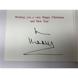 2003 Royal Christmas card with gilt embossed Prince of Wales crest to cover, the interior with black and white photograph of a smiling Prince Charles, now King Charles III, Prince William and Prince Harry, signed in autopen 'from Charles', with indistinct name to top