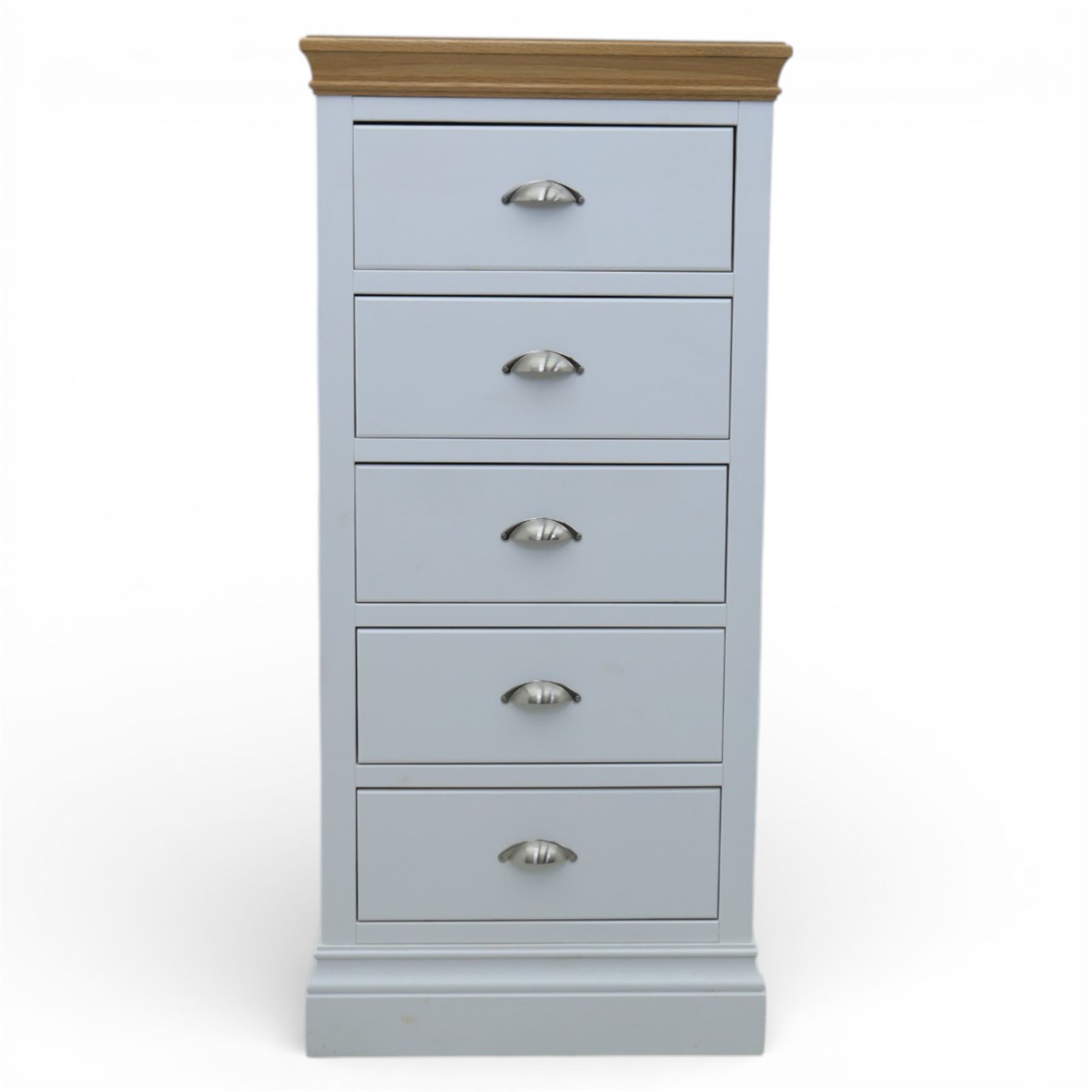 Modern narrow chest of five drawers in white finish with oak moulded top, with metal cup handles raised on a moulded plinth base