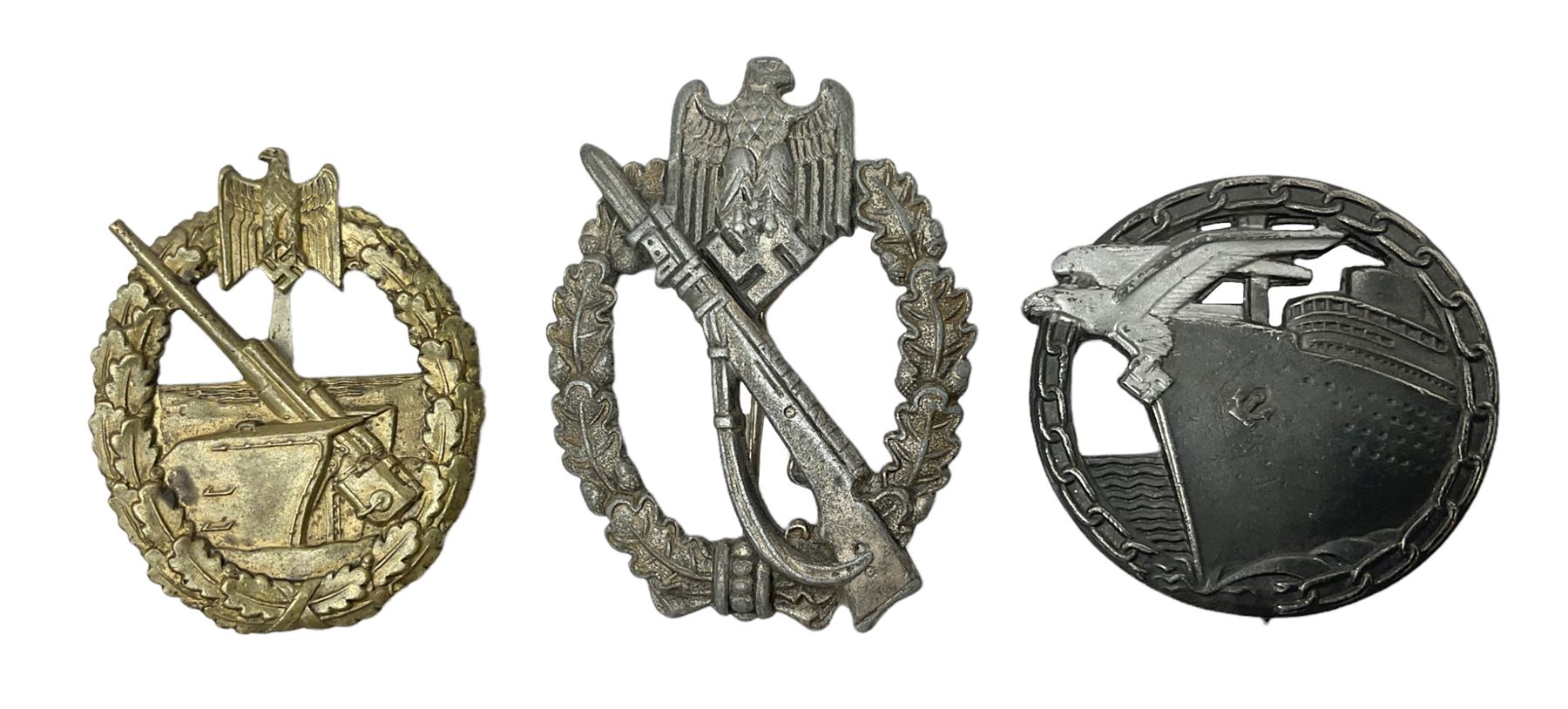 Three WW2 German badges comprising Blockade Runner War Badge and Coastal Artillery badge, both marked 'Fec Otto Placzec Berlin'; and Infantry Assault Badge; all with fixing pins (3)