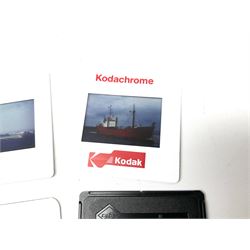 Over one thousand three hundred and fifty annotated and dated photographic slides of worldwide shipping and maritime interest including warships, naval and merchant vessels, 1960s - 2000s, contained in five matching plastic slide boxes, each with an index