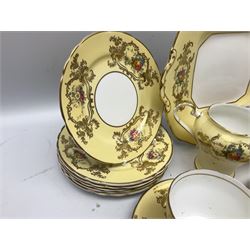 Aynsley tea service for six, decorated with floral sprays in ornate gilt detailing on cream ground, comprising six teacups and saucers, open sucrier and milk jug and cake plate, all with printed marks beneath