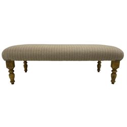 Traditional shape footstool, rectangular seat upholstered in neutral coloured striped woollen fabric, on turned beech supports