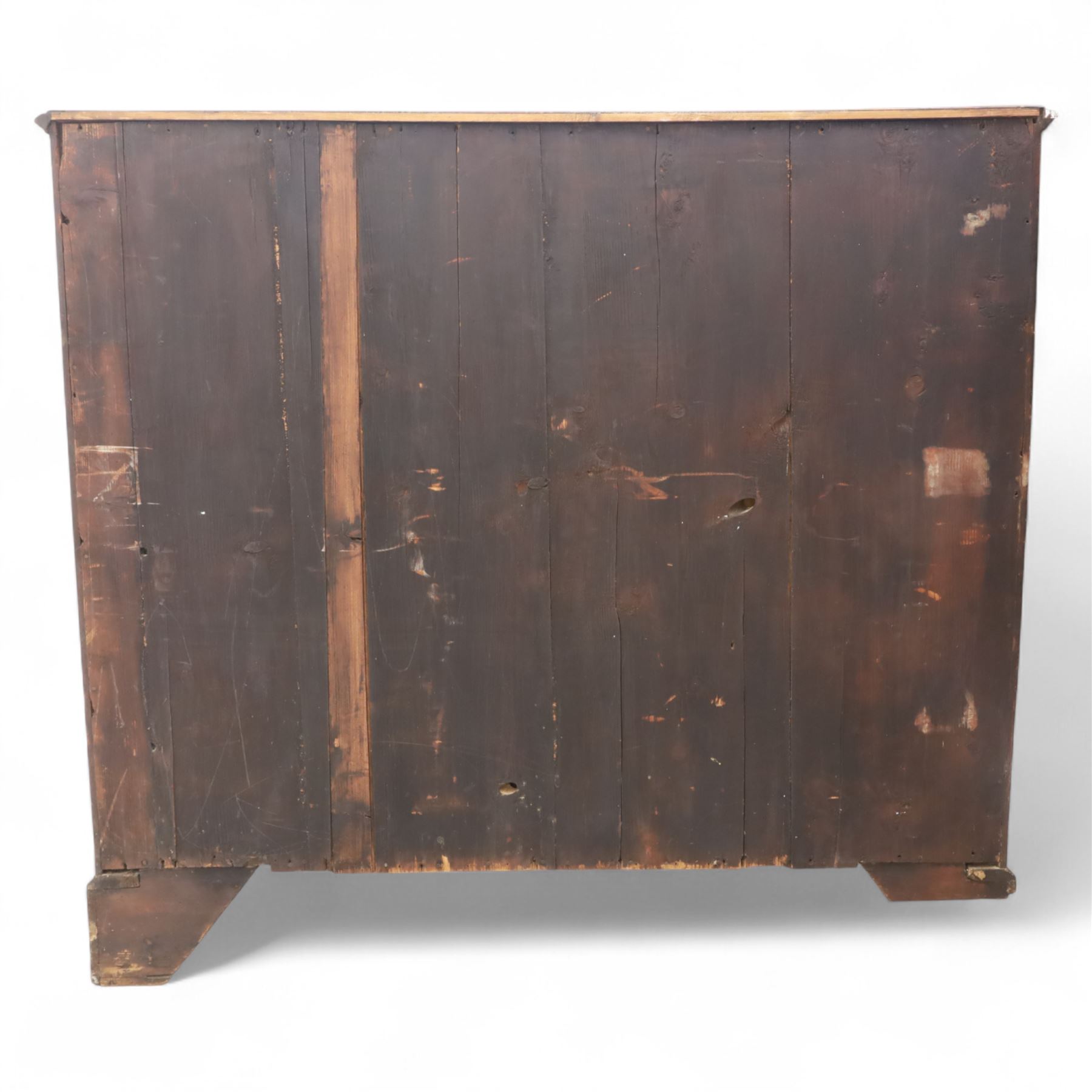 Late 19th-century Georgian-style mahogany chest of drawers, rectangular top with moulded edge over two short and three graduated drawers, raised on bracket feet, back foot missing 