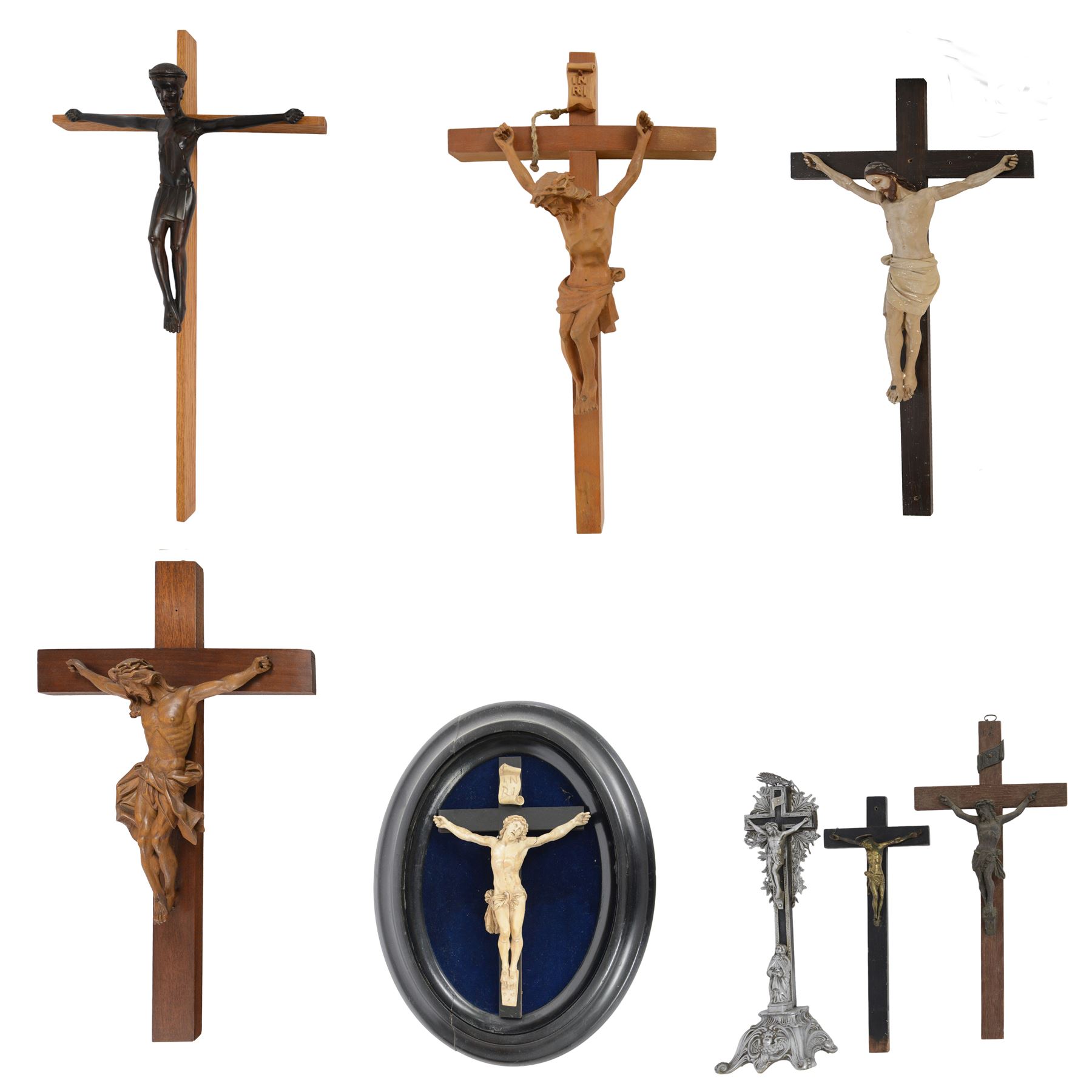 Eight crucifixes with Corpus Christi, various ages and materials, including wood and medal examples, largest H120cm 