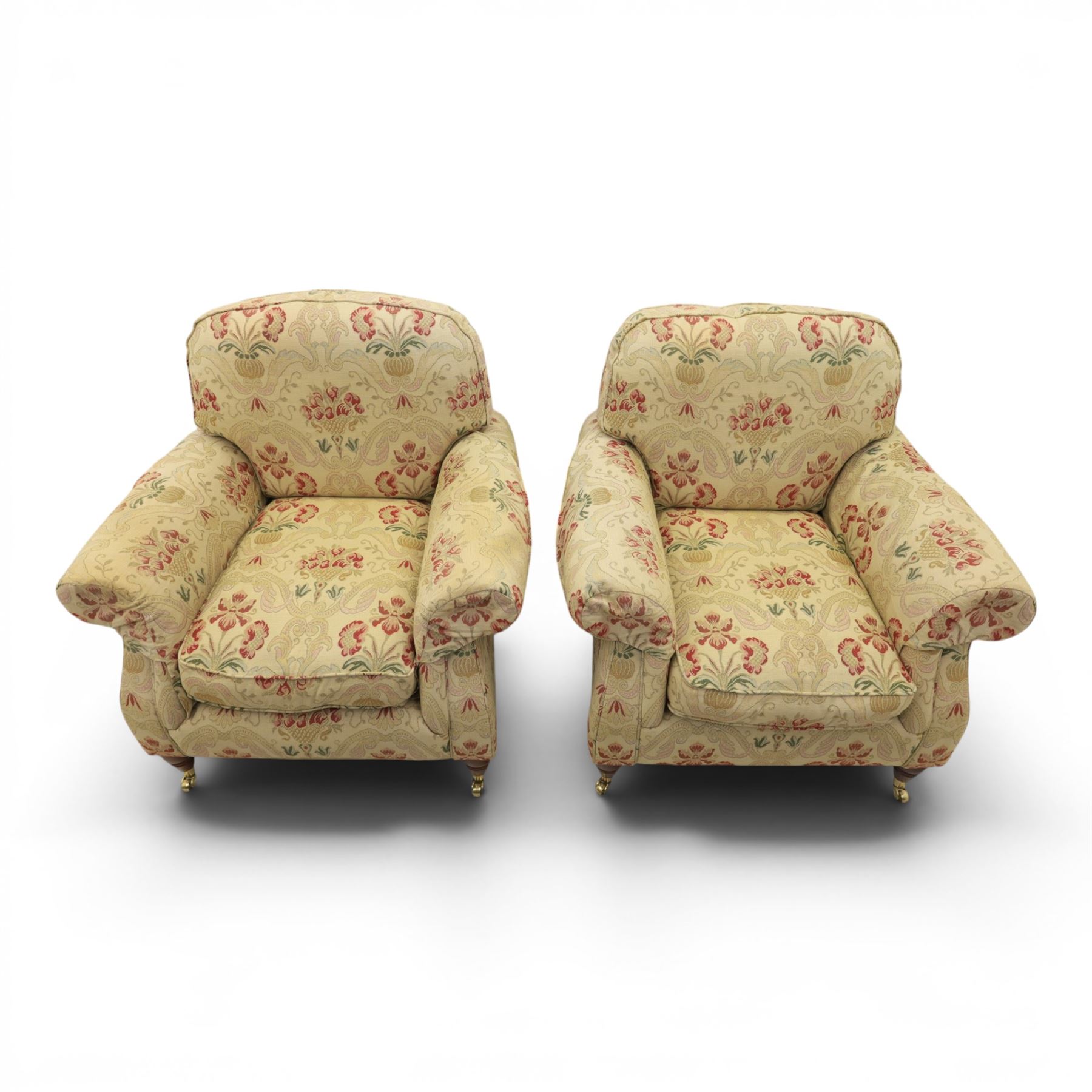 Parker Knoll - 'Henley' floral fabric living room suite, comprising a two seat sofa and pair of armchairs, raised on dark stained turned feet raised on brass castors

Armchairs (H 99cm, W 95cm, D 100cm)