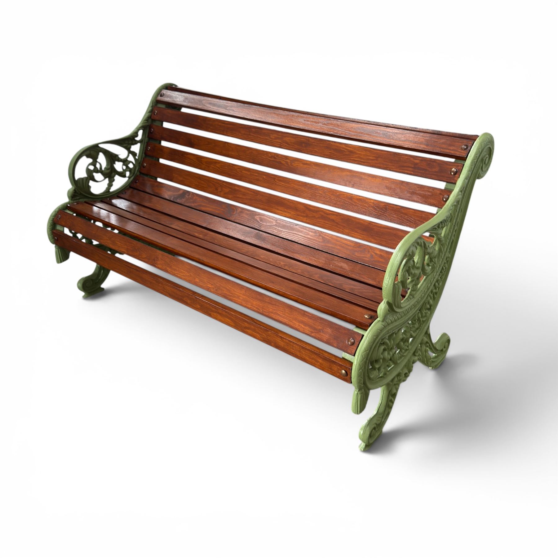 Pair of Victorian design cast iron and slatted wooden garden benches, the ornate pierced end supports of scrolled form, the pierced acanthus leaves interspersed with trailing flowerheads, with tassels to the front, raised on splayed feet, the supports in pale sage green painted finish