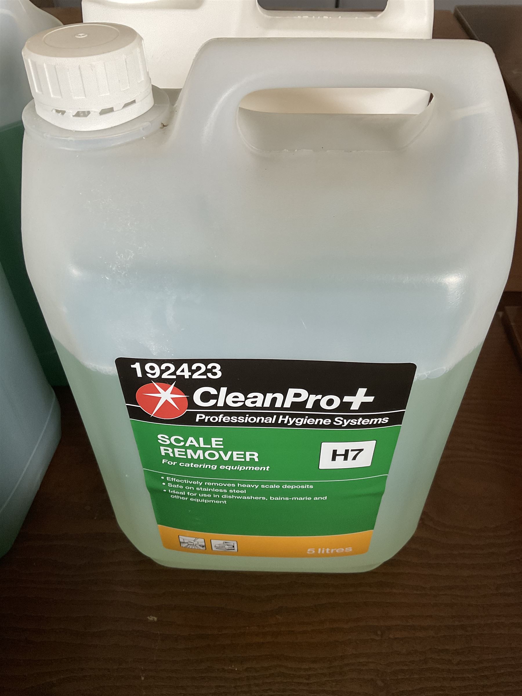 Assortment of cleaning products, washing up liquid, floor gel, bin