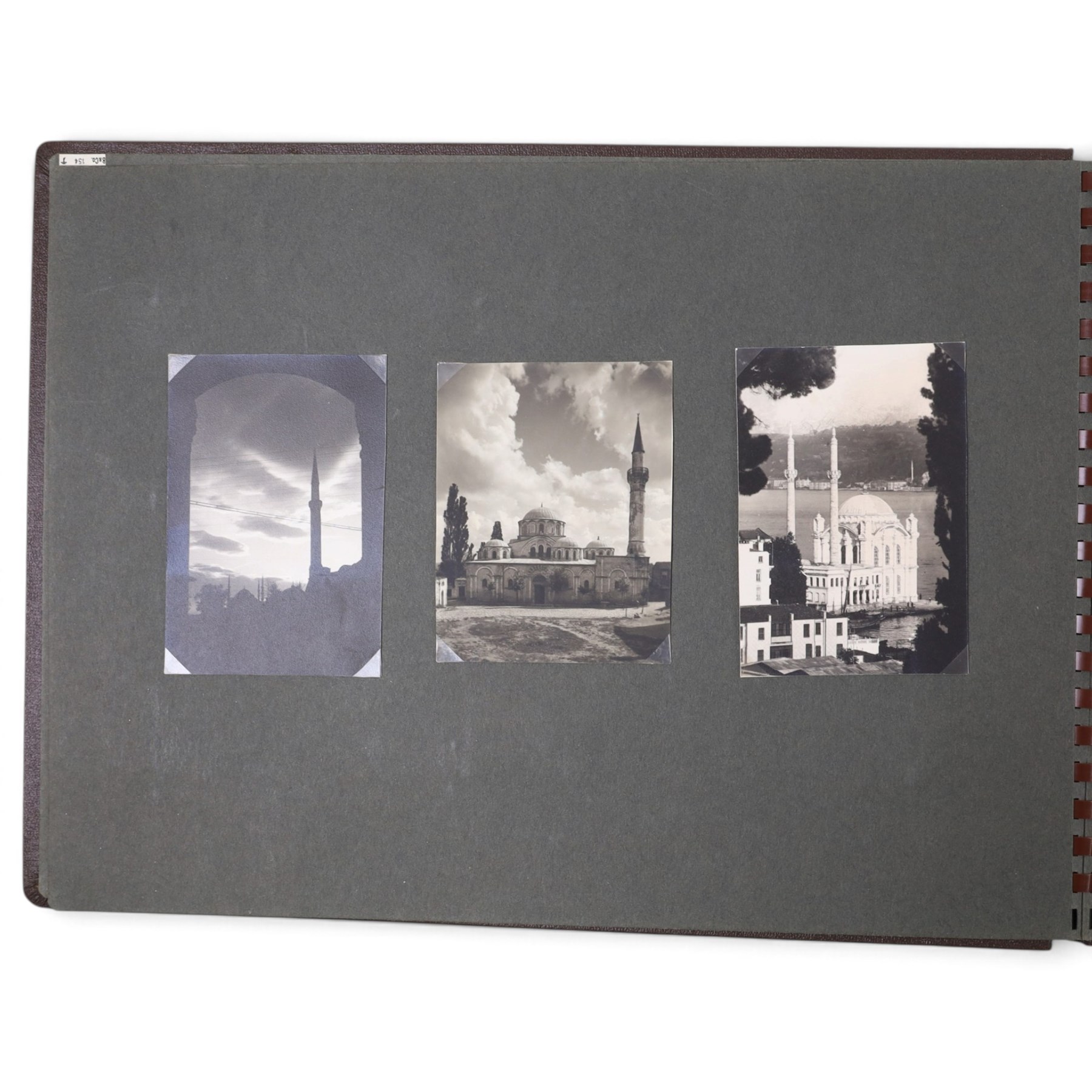 Two early to mid 20th century postcard albums, containing black and white and colour postcards of France, Turkey and Egypt, together with some personal photographs and newspaper clippings