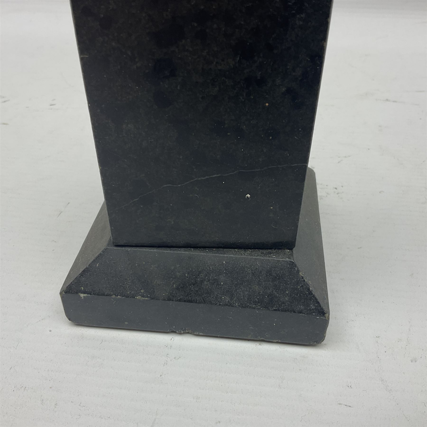 Bronzed semi nude female figure with one hand raised, upon a marble plinth, H43cm  