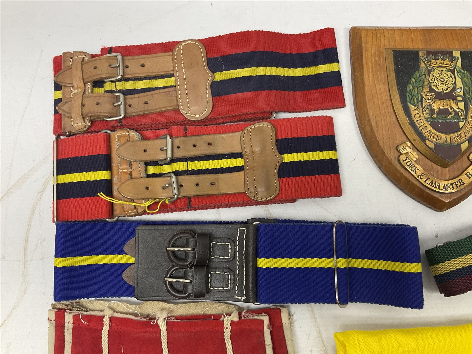 Miscellaneous militaria including two Royal Artillery and one Royal Horse Artillery stable belts; Northamptonshire Regiment trench art brass shell case lighter; unused Matchless Fire-Set; pocket knives and multi-tool; lanyards; oak shield with York & Lancaster crest etc