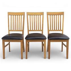 Solid light oak extending dining table with single leaf, and set of six chairs