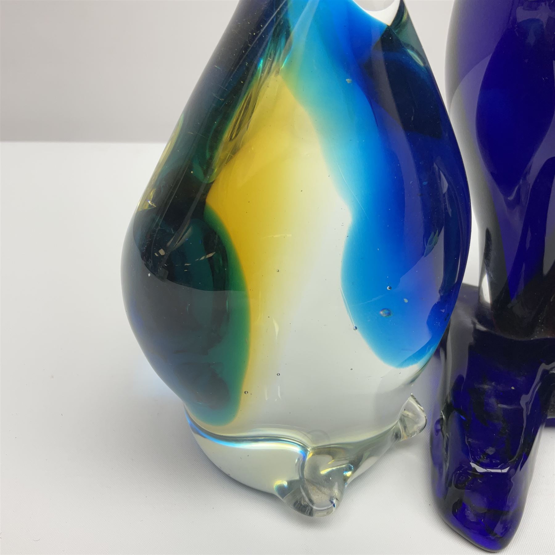 Murano glass clown, together with two glass penguin paperweights, clown H28cm