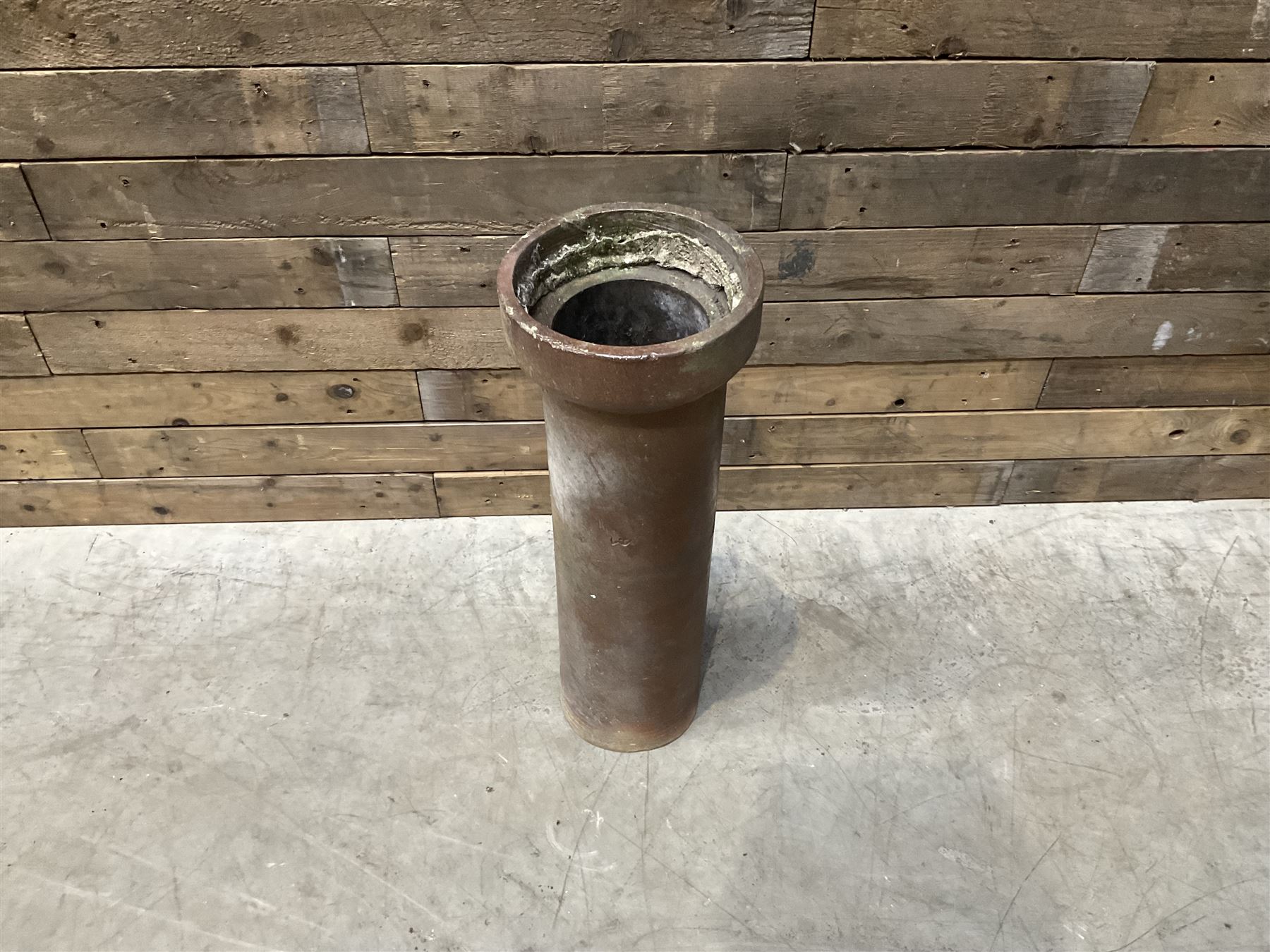 3 cauldron set pots with 2 terracotta chimney pots, 1 terracotta crock, metal bucket and small cast iron shelf 