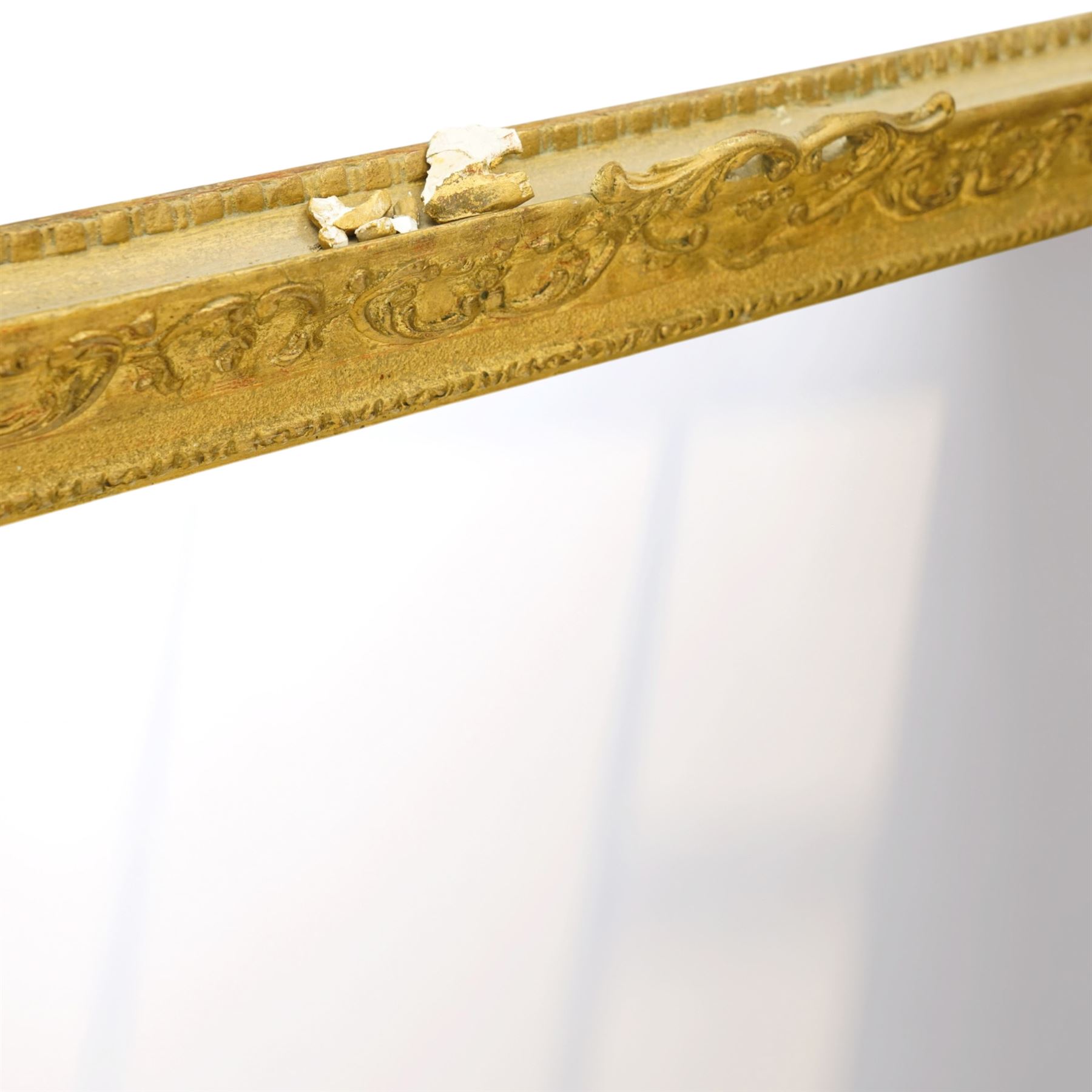 Large Louis XV style gilt framed mirror, the rectangular plate within a pierced and moulded surround decorated with foliate scrolls and flowerheads