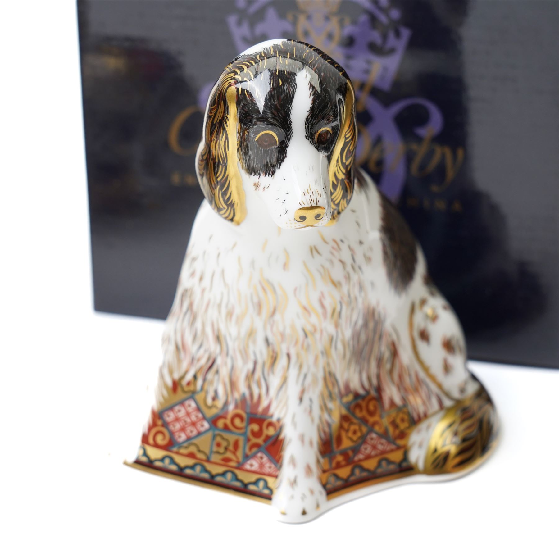 Six Royal Crown Derby paperweights comprising 'Hawthorne' hedgehog with gold stopper, baby rabbit with gold stopper, 'Molly' dog guild exclusive with gold stopper, farmyard hen with gold stopper, woodland squirrel with gold stopper, and collectors guild puppy with gold stopper, all boxed (6)