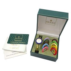 Gucci ladies gold-plated quartz wristwatch, Ref. 11/12.2, with eleven interchangeable coloured ring bezels, boxed with warranty card dated 1997 