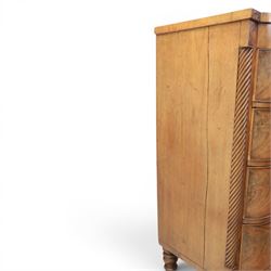 Victorian mahogany bow fronted chest, fitted with two short and three long drawers, flame mahogany front, bone escutcheons and turned wooden handles, quarter barley twist columns, raised on turned supports