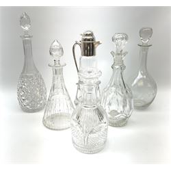 A clear glass claret jug with silver plated mount, together with a selection of decanters, to include an Edwardian etched example, a Georgian style cut glass example, another example marked beneath Stuart England, etc. (6). 