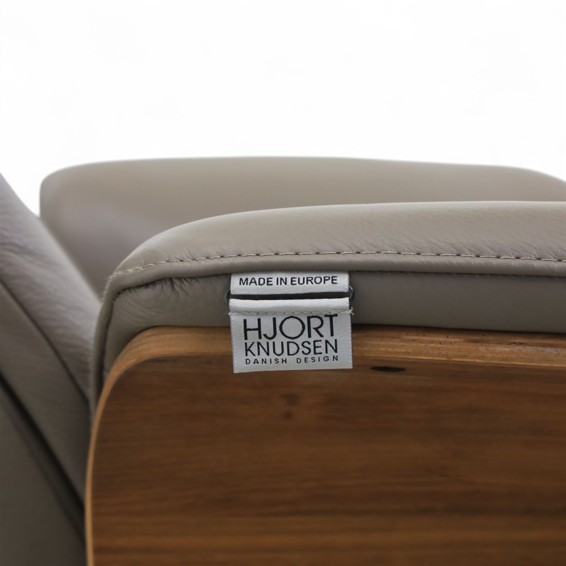 Hjort Knudsen - Danish electric reclining and swivel armchair upholstered in pewter leather, raised on a plywood frame above a five point base