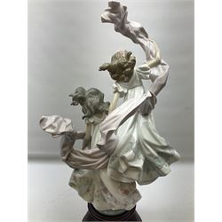 Large Lladro figure, Allegory of Liberty, modelled as two ladies dancing on a mahogany base, with original box, no 5819, year issued 1991, H63cm 