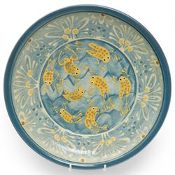 Coxwold studio pottery charger, decorated in a blue and yellow glaze with swimming frogs, together with three mugs with similar swimming fish and frogs, each painted or impressed mark, charger D33cm (4)