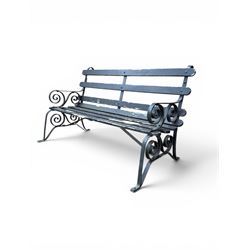 Coalbrookdale - rare pair of wrought iron and slatted wood garden benches, the twin wrought iron strapwork bench-ends formed of four scrolls over splayed feet, number 77 in the Coalbrookdale Castings Catalogue (see illustration)