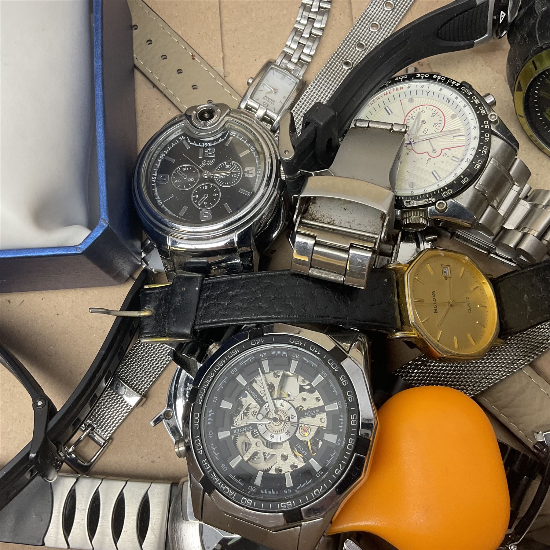 Collection of wristwatches, makers including Bulova and Ingersoll, and some watch makers equipment including glasses, vice and watch back opener