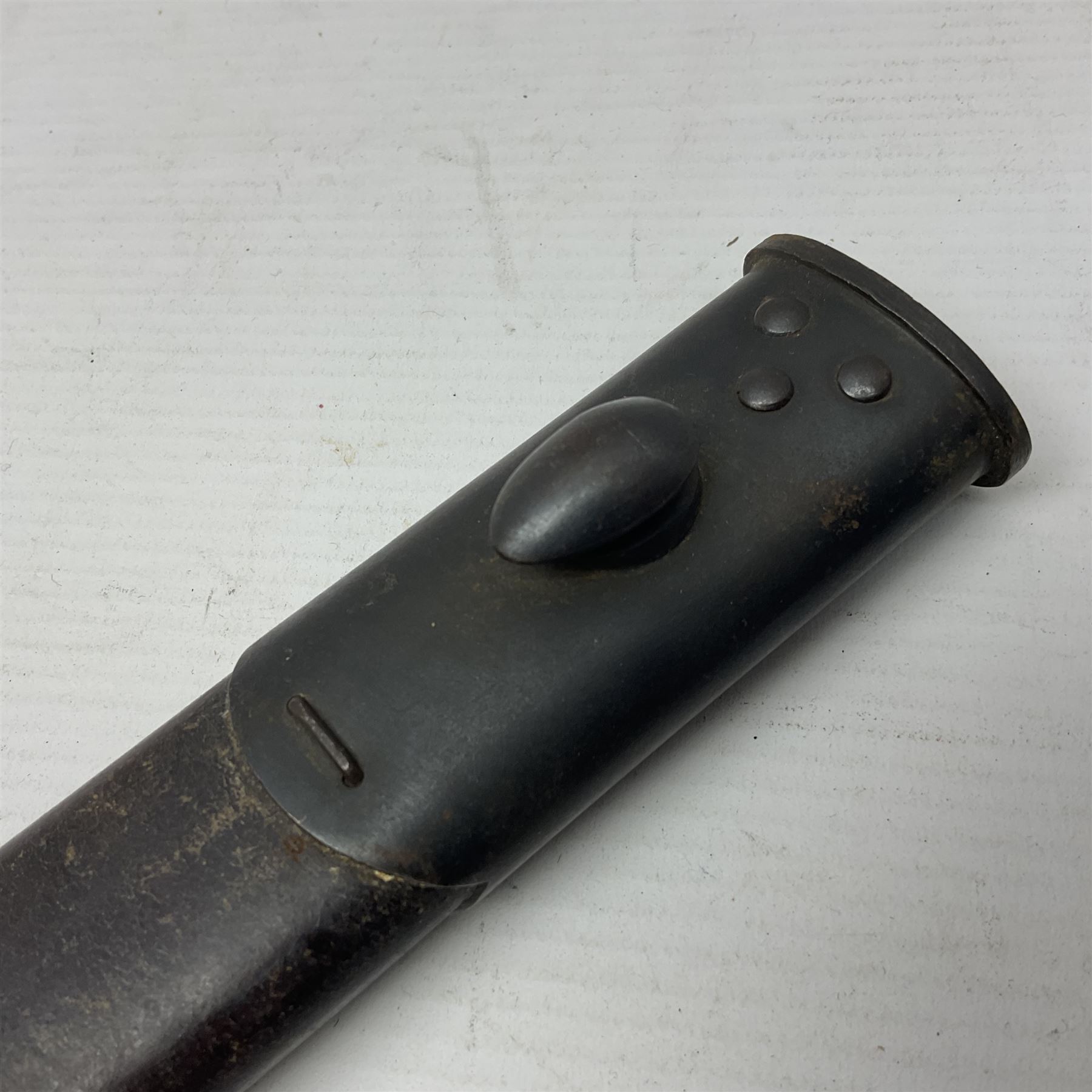 British Pattern 1888 knife bayonet, the 30.5cm double edged blade with raised central medial ridge; in leather covered scabbard L40.5cm overall