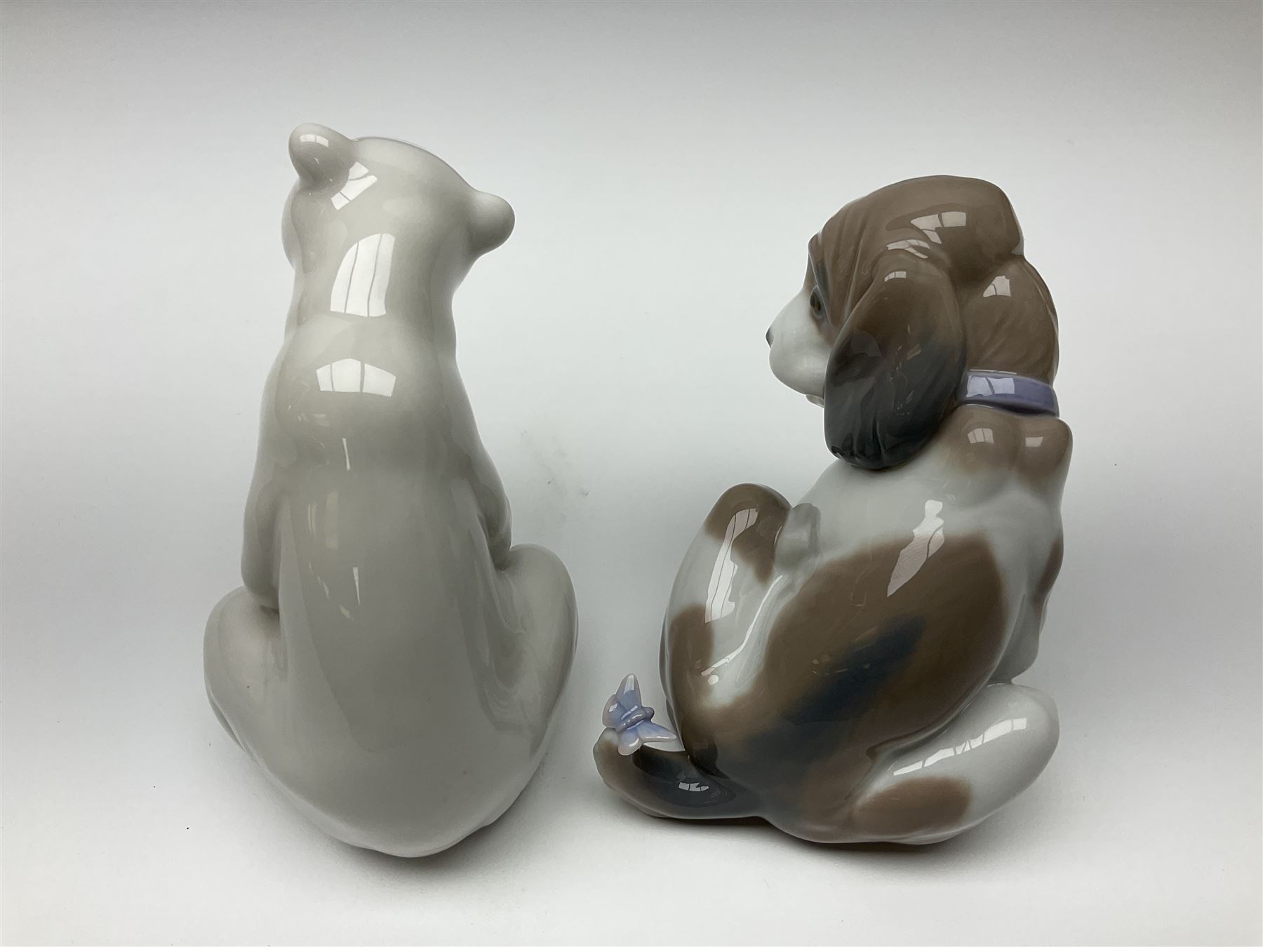 Five Lladro figures, comprising Cat and Mouse no. 5236, That Tickles no. 5888, Gentle Surprise no. 6210, Little Hunter no. 6212 and Resting Polar Bear no. 1208, largest H12cm