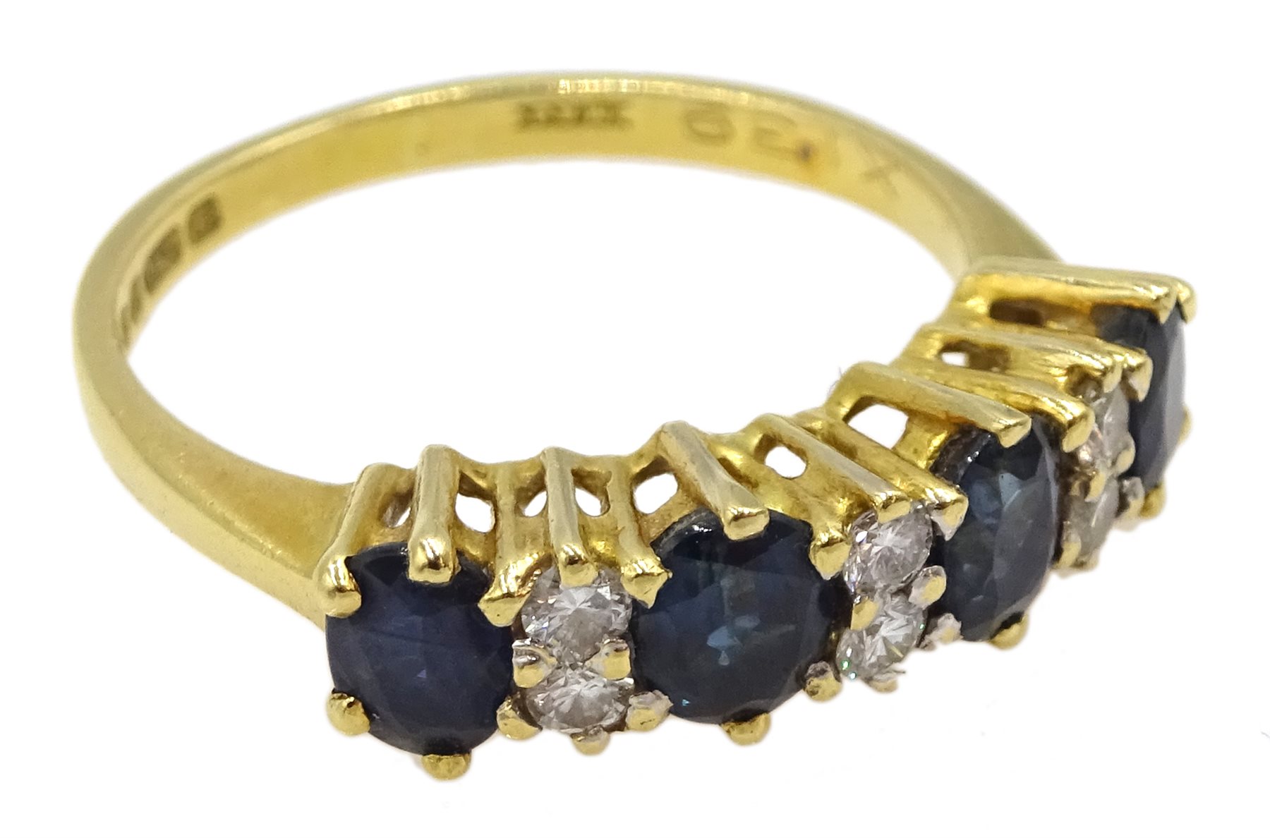 18ct gold four stone oval sapphire and six stone diamond ring, London 1981