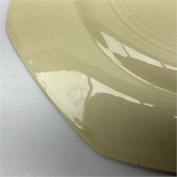 Clarice Cliff Bizarre for Newport Pottery Orange Roof Cottage pattern plate, circa 1932, hand painted with a stylised cottage and bridge landscape with yellow, orange and black banding, black printed mark beneath, D22cm 