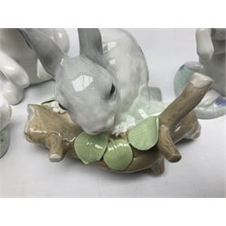 Four Lladro rabbit figures, comprising, Hippity Hop no 5886, Sitting Bunny no 5907, Washing up no 5887, and Rabbit Eating no 4773, largest example 14cm  