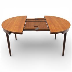 Frem Røjle - Danish teak 'Roundette' extendable dining table, circular top with softly chamfered edge and internal stowable leaf extends to 156cm, raised on four tapered cylindrical legs, accompanied by four matching dining chairs with shaped teak frames and black vinyl upholstered seats, the chairs designed to nest beneath the table when not in use