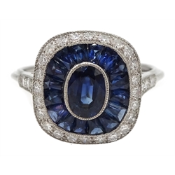  Platinum sapphire and diamond ring, the central oval sapphire surrounded by halo of calibre cut sapphires and diamonds  
[image code: 4mc]