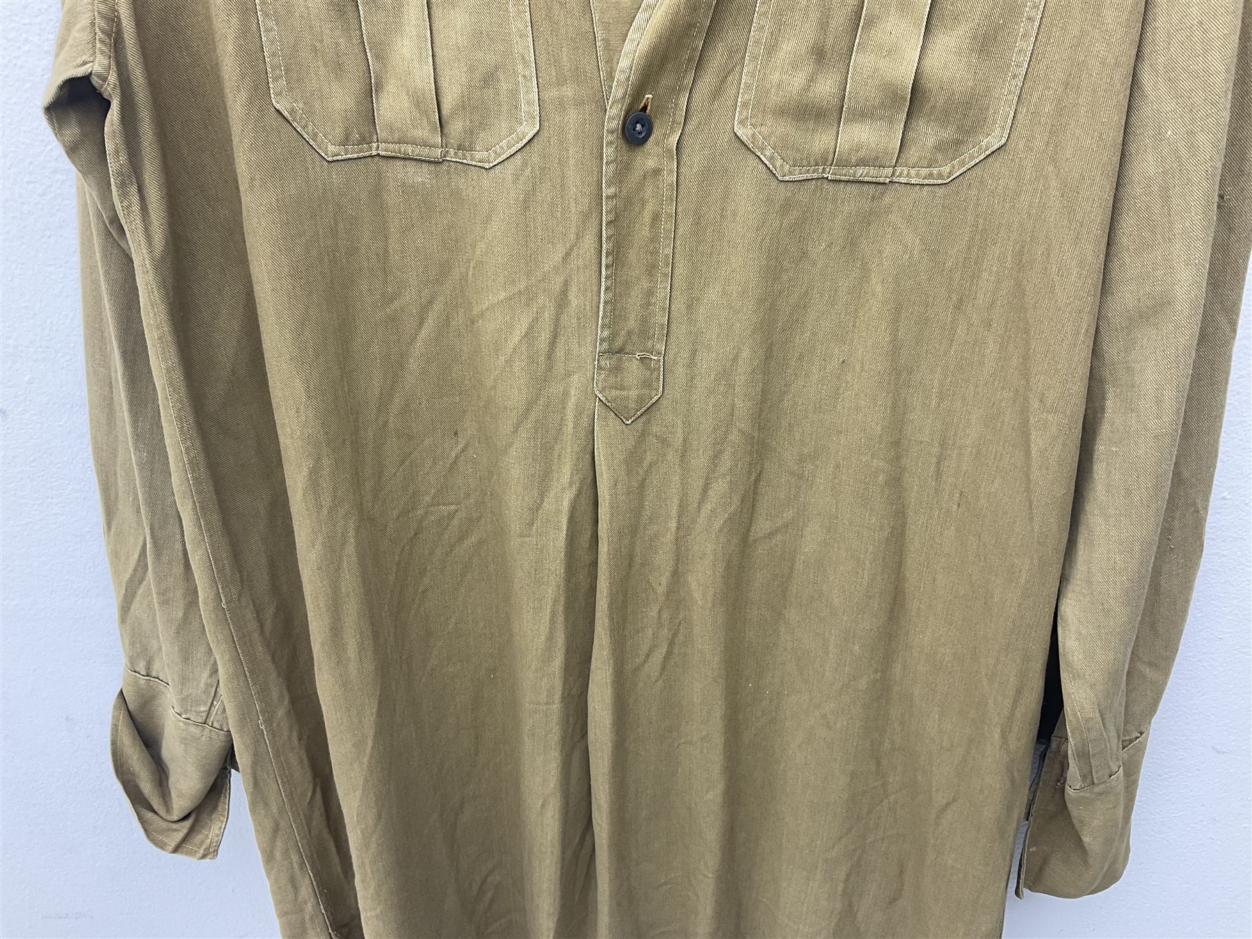 1930s Hitler Youth brown shirt, long length with two pockets, bears triangular badge 'Nord Nordsee'