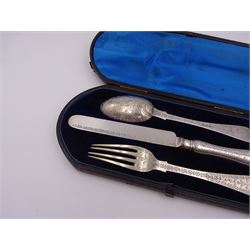 Victorian silver cutlery set, comprising knife, fork and spoon, all profusely engraved with flower heads, each with initials terminals, hallmarked Chawner & Co Birmingham 1877, contained within tooled leather, velvet and silk lined fitted case
