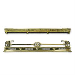 Two Edwardian brass fire curbs, comprising a decorative example with pierced vertical frie...