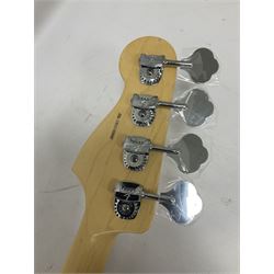 Fender Precision Bass guitar, in Olympic White finish with tortoiseshell effect scratchboard, serial no US15103092, in black Fender hard case with Fender strap and warranty card, guitar L116cm