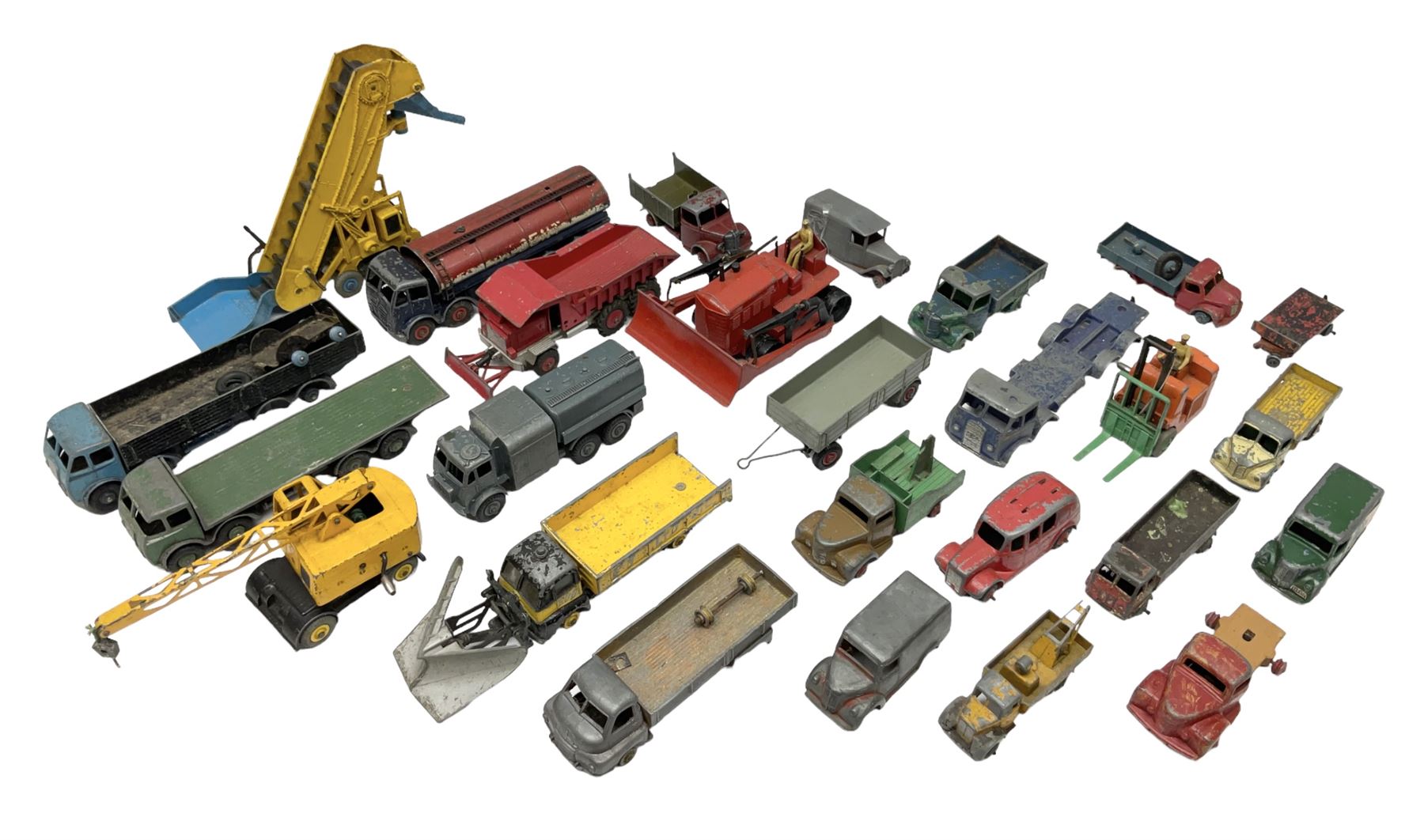 Dinky - twenty-six unboxed and playworn die-cast models including Foden Regent Tanker, two Foden lorries, Pressure Refueller No.642, Snow Plough, Elevator Loader, Foden Dump Truck, Blaw Knox Bulldozer and other commercial vehicles